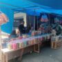 Omzet Anjlok di Tempat Relokasi, Puluhan Pedagang Kue Kembali Sepihak ke Jalan Palapa.